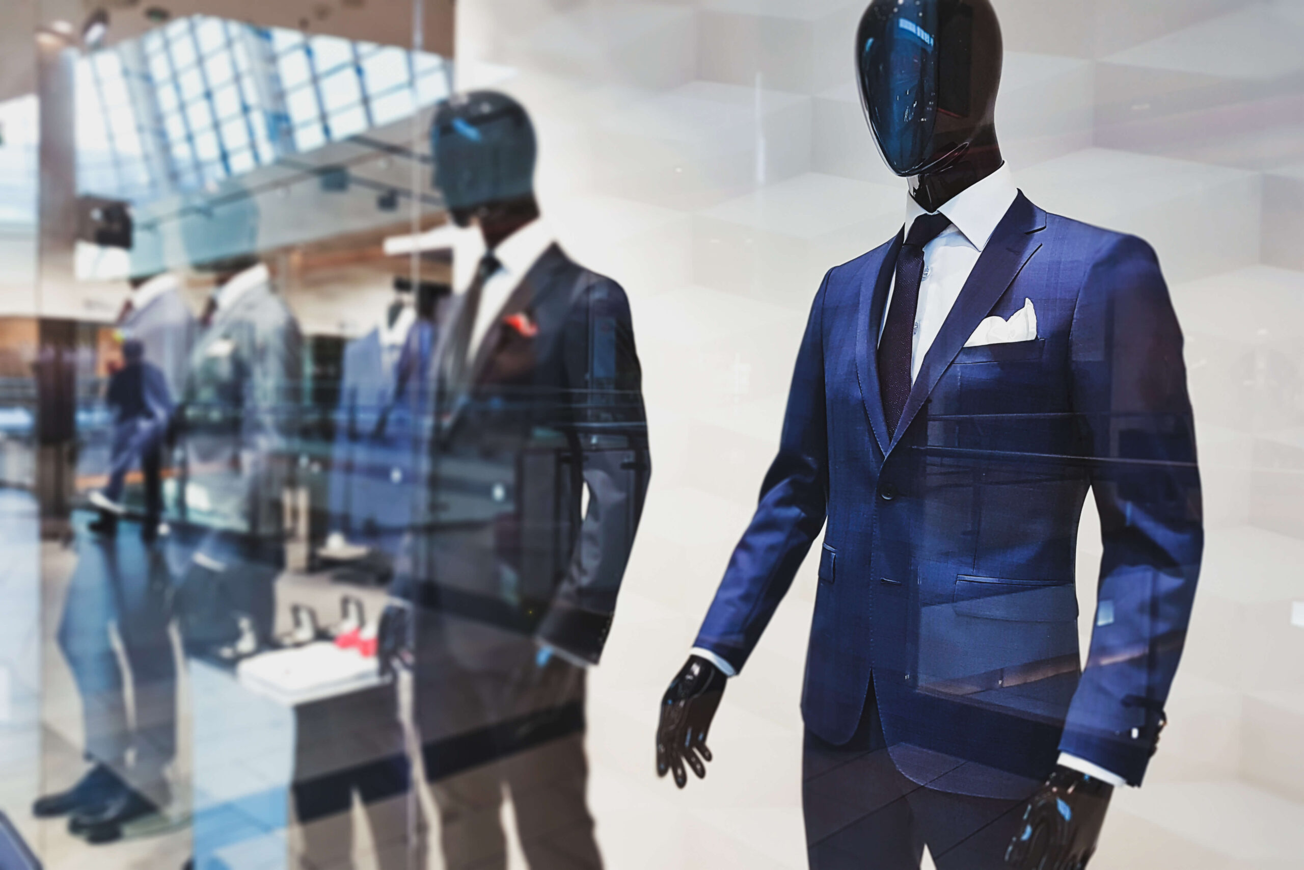 storefront with fashionable suits for men